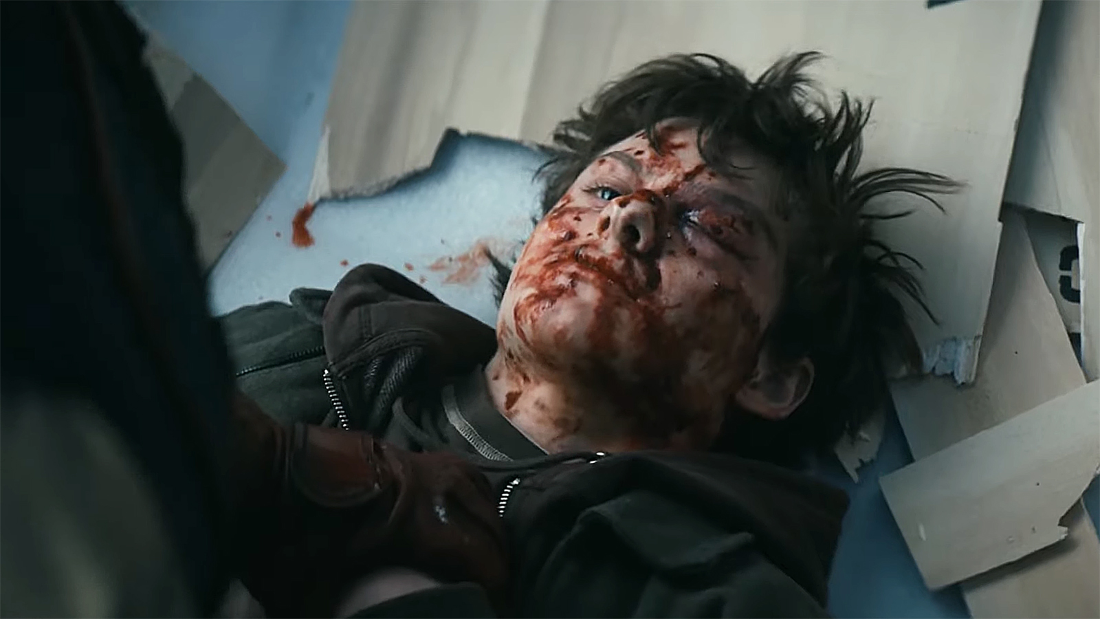 A bloodied and battered Ryan lying on the floor in The Boys season 5 episode 3