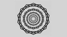 The new "scintillating starburst" illusion, bright rays emenate from the centre of the design through concentric wreaths of star-polygons.