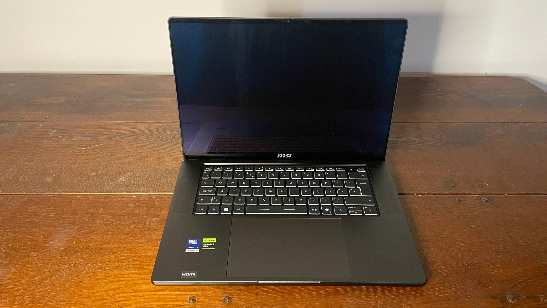 An MSI Stealth 16 AI+ gaming laptop with RTX 5080 mobile (125 W).