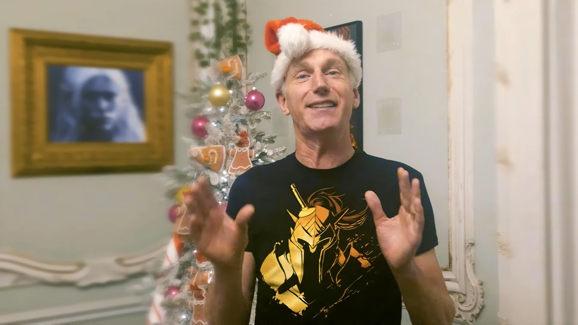 Swen Vincke in a Santa hat and Larian t-shirt.