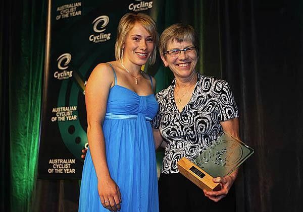 Masters cyclist of the year Elizabeth Randall gets her trophy from downhill rider Caroline Buchanan.