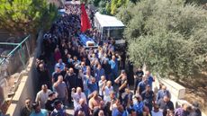 People attend the funeral ceremony held for Fatima Abdullah, who died in the pager explosion, in Beqaa, Lebanon