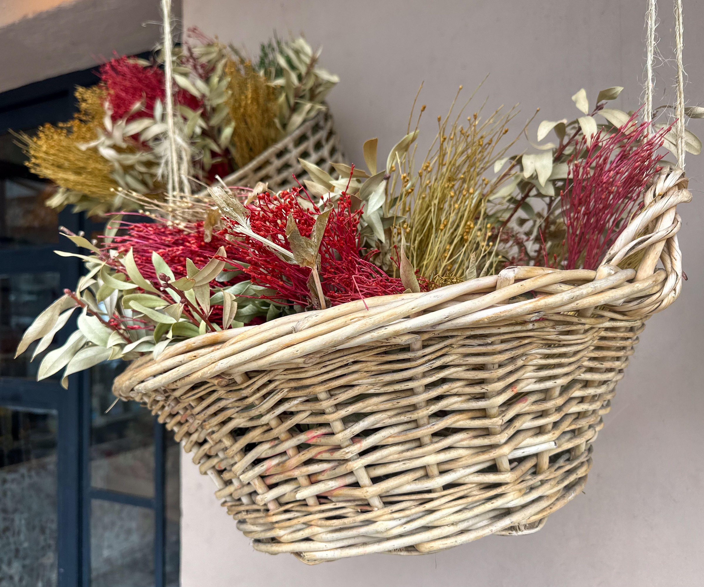 Dried floral arrangement in hanging basket