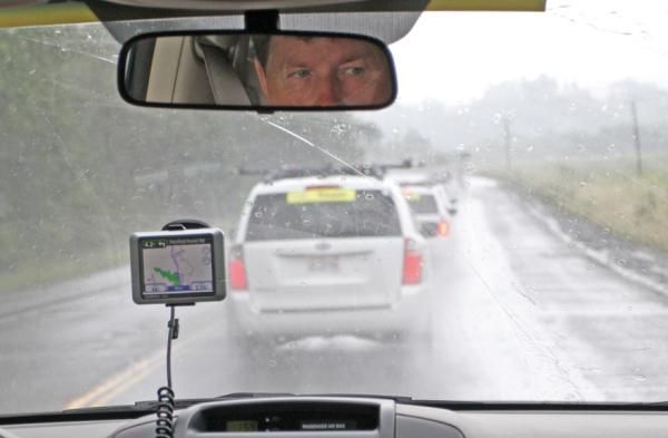 With feed zone duties completed, the race of mini-vans takes place as soigneurs scramble to the finish line, where they will receive riders at the end of the stage. Rains on stage 2 make for an even heavier workload for all staff.