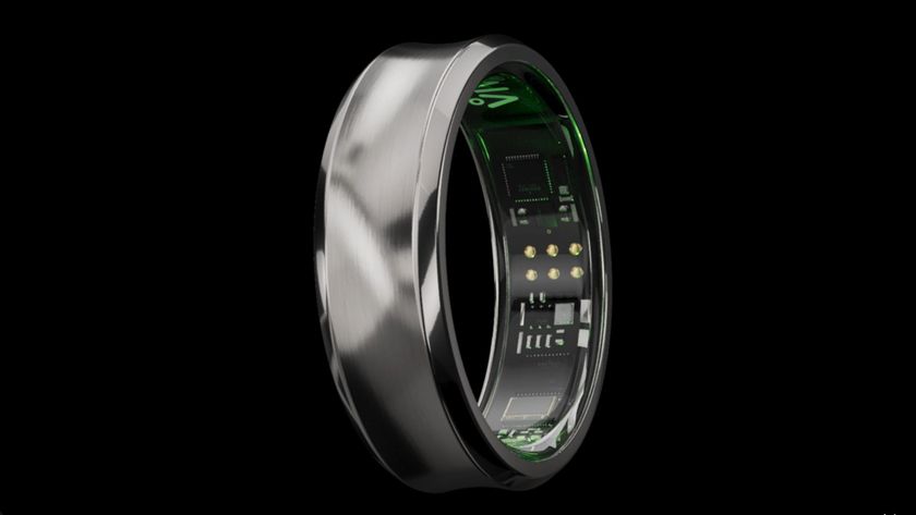 Black titanium VIV Ring with green-lit smart sensors on black background 