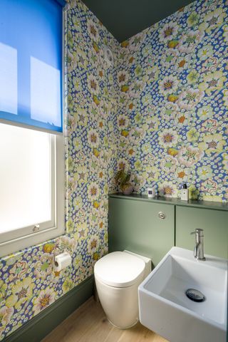 downstairs cloakroom with bright wallpaper