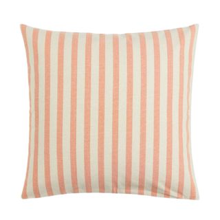 Vertically striped H+M pillow in cream and orange