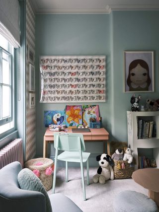 A small playroom with a table and chair