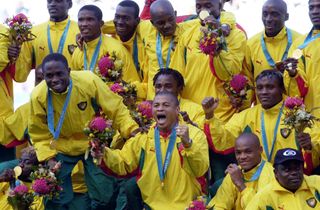 Cameroon players celebrate with their gold medals after victory against Spain in the men's football final at the 2000 Olympics in Sydney.