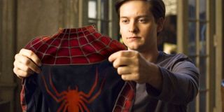 Spider-Man Tobey Maguire looks at his spider suit