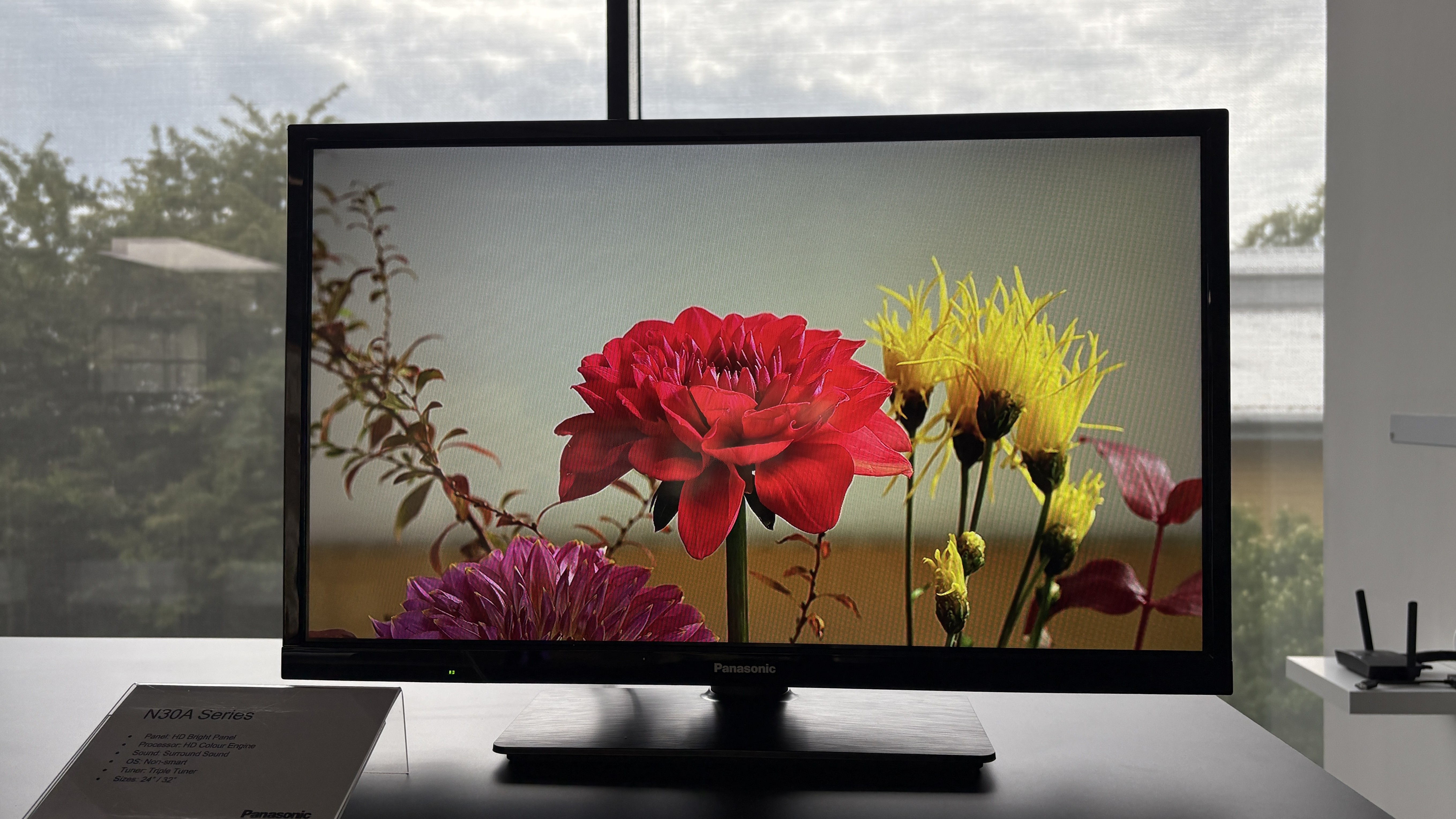 Panasonic TVs on a black show stand