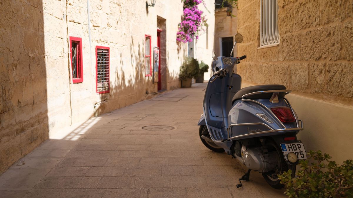 Fujifilm X100VI image gallery: blur vespa down an old alleyway in Valetta, Malta