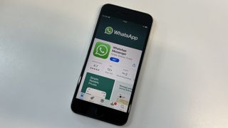 An iPhone SE 2022 with WhatsApp's App Store page open