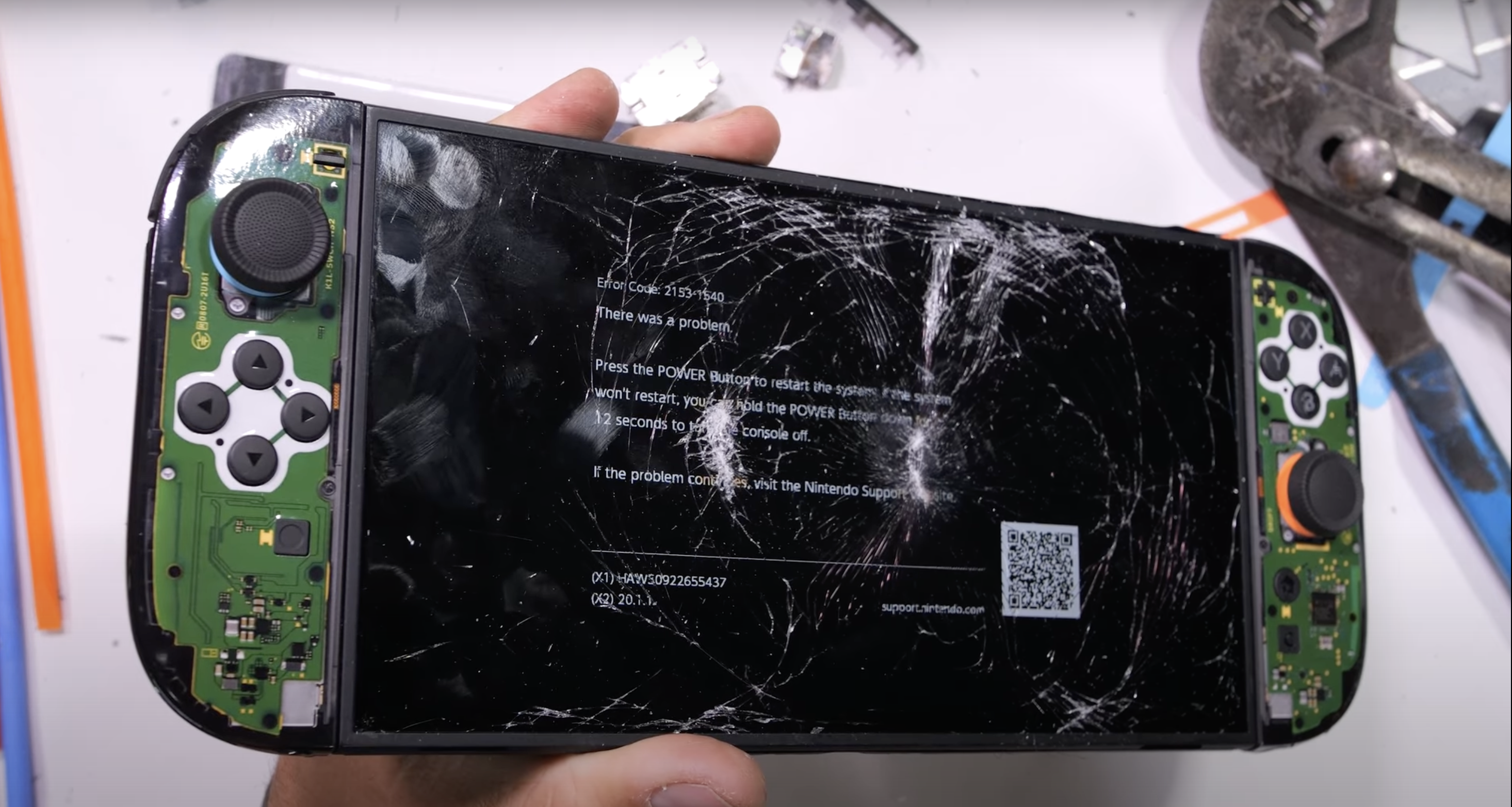 YouTuber showing off the shattered Switch 2.