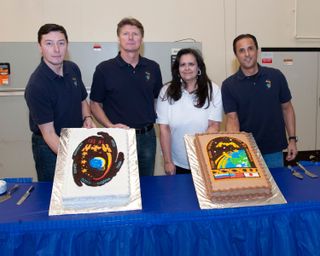 Crewmembers Pose with Cake