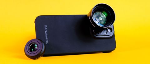 A photo of a Sandmarc iPhone lens attached to an iPhone 15 Pro using the Sandmarc iPhone case, all against a yellow background