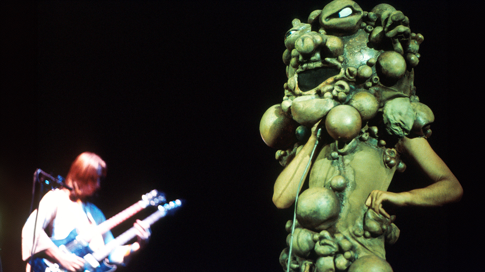 Singer Peter Gabriel of Genesis performing on stage circa 1974 during the tour for The Lamb Lies Down on Broadway, dressed as the Slipperman