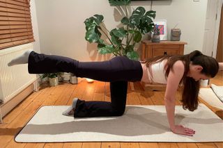 Writer Dionne Brighton practicing Pilates moves during a Pilates challenge