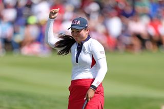 Allisen Corpuz fist pumps after holing a putt on the 14th green