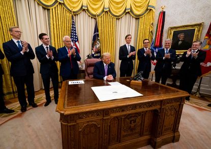 President Donald Trump leads a meeting with leaders of Israel and UAE announcing a peace agreement to establish diplomatic ties with Israel and the UAE, in the Oval Office of the White House 