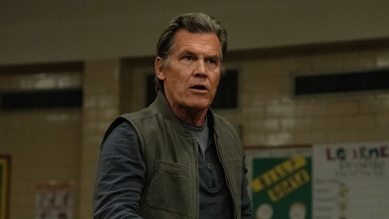 Josh Brolin standing up at school meeting in Weapons