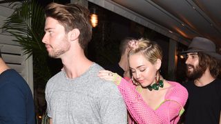 Miley Cyrus and Patrick Schwarzenegger attend the Jeremy Scott & Moschino party with Barbie