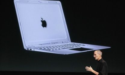 Steve Jobs introduces a new slender MacBook Air model, starting at $999, during Apple's special event. 