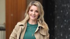 Helen Skelton wearing a trench coat, green top and skirt on January 24, 2019