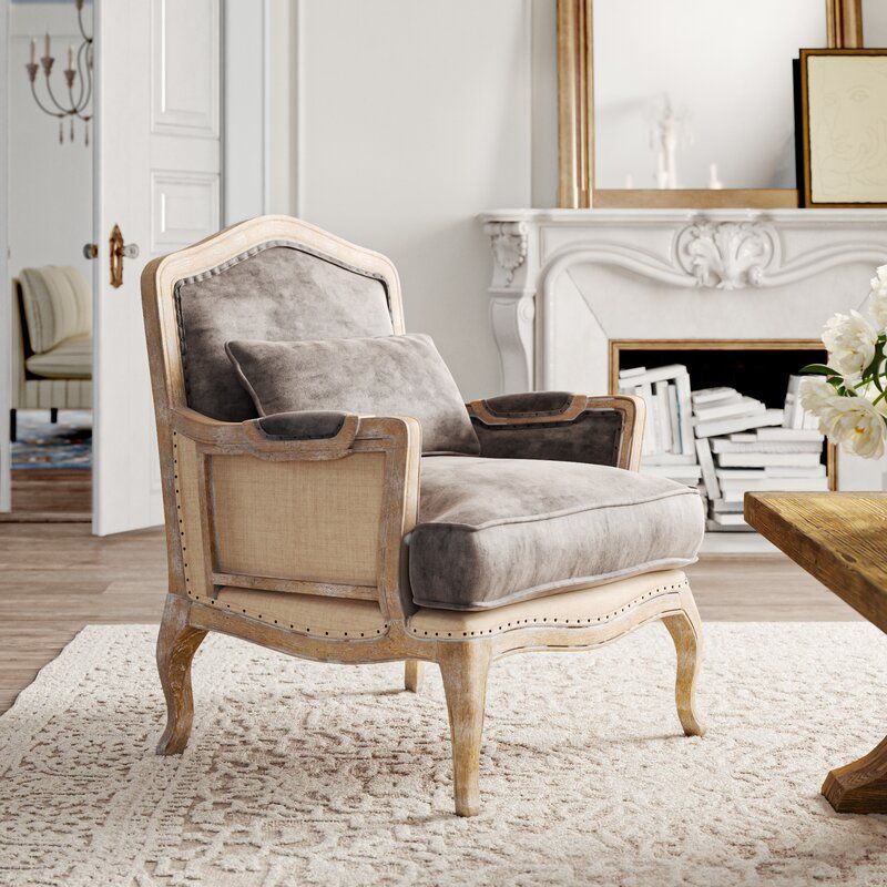 A wide upholstered armchair that