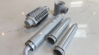 The T3 Aire 360 base surrounded by attachments &ndash; oval brush, SoftAire drying concentrator and two ceramic curling barrels