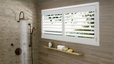 Shower with slim landscape shower window with white shutters