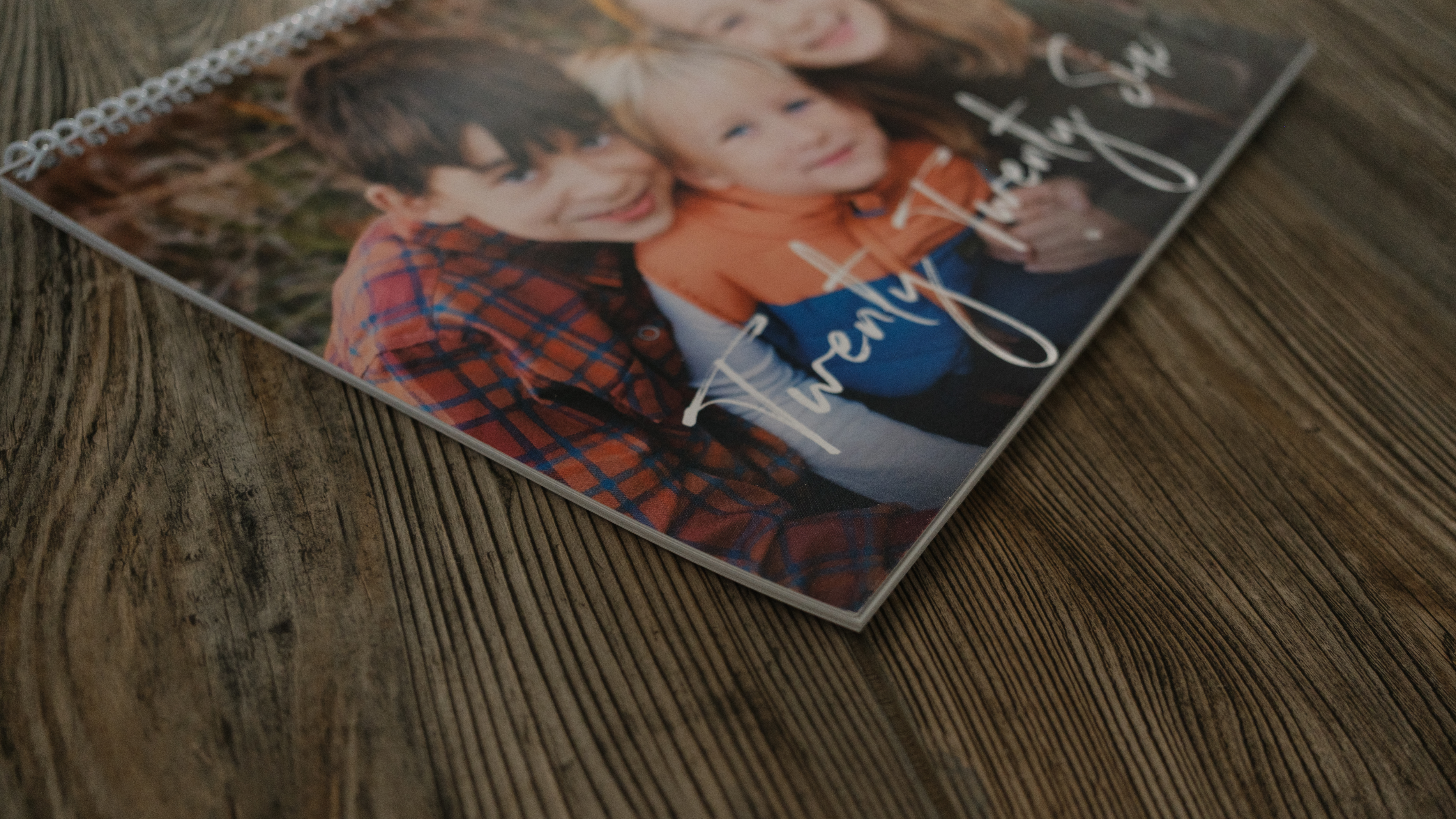 A photo calendar from Nations Photo Lab on a wood background