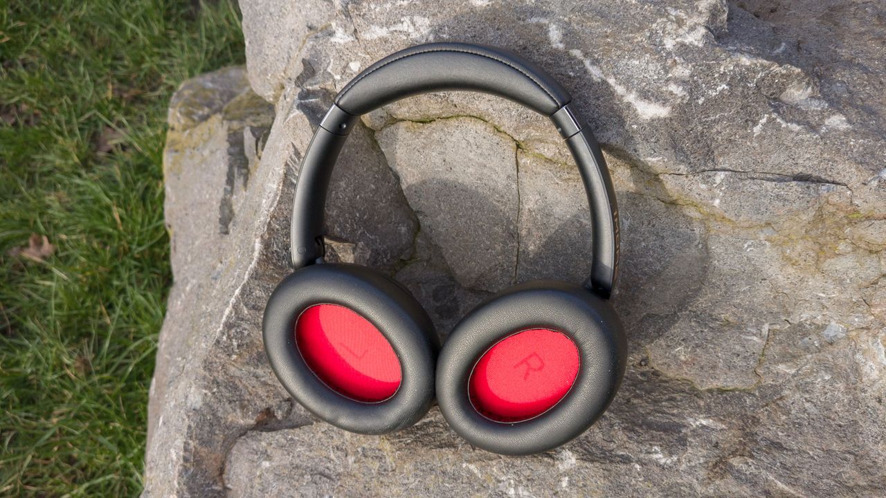 1More Sonoflow Pro showing off their red earcups on a big rock in the sun