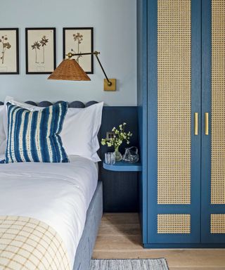 blue bedroom with rattan wardrobes by Mark Bolton