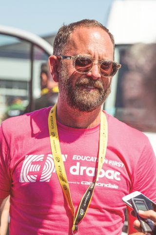 Jonathan Vaughters in a pink EF T-shirt