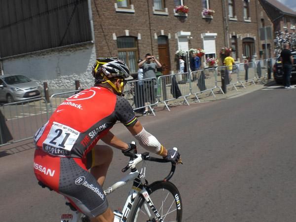 Lance Armstrong rides to the sign in