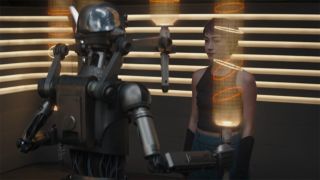 Still from the Star Wars T.V. series Ahsoka, season 1, episode 3. Sabine's training with Huyang (robot) is resumed.