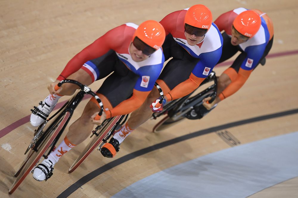 The Netherlands' Theo Bos, Matthijs Buchli and Jeffrey Hoogland compete in the men's Team Sprint qualifying