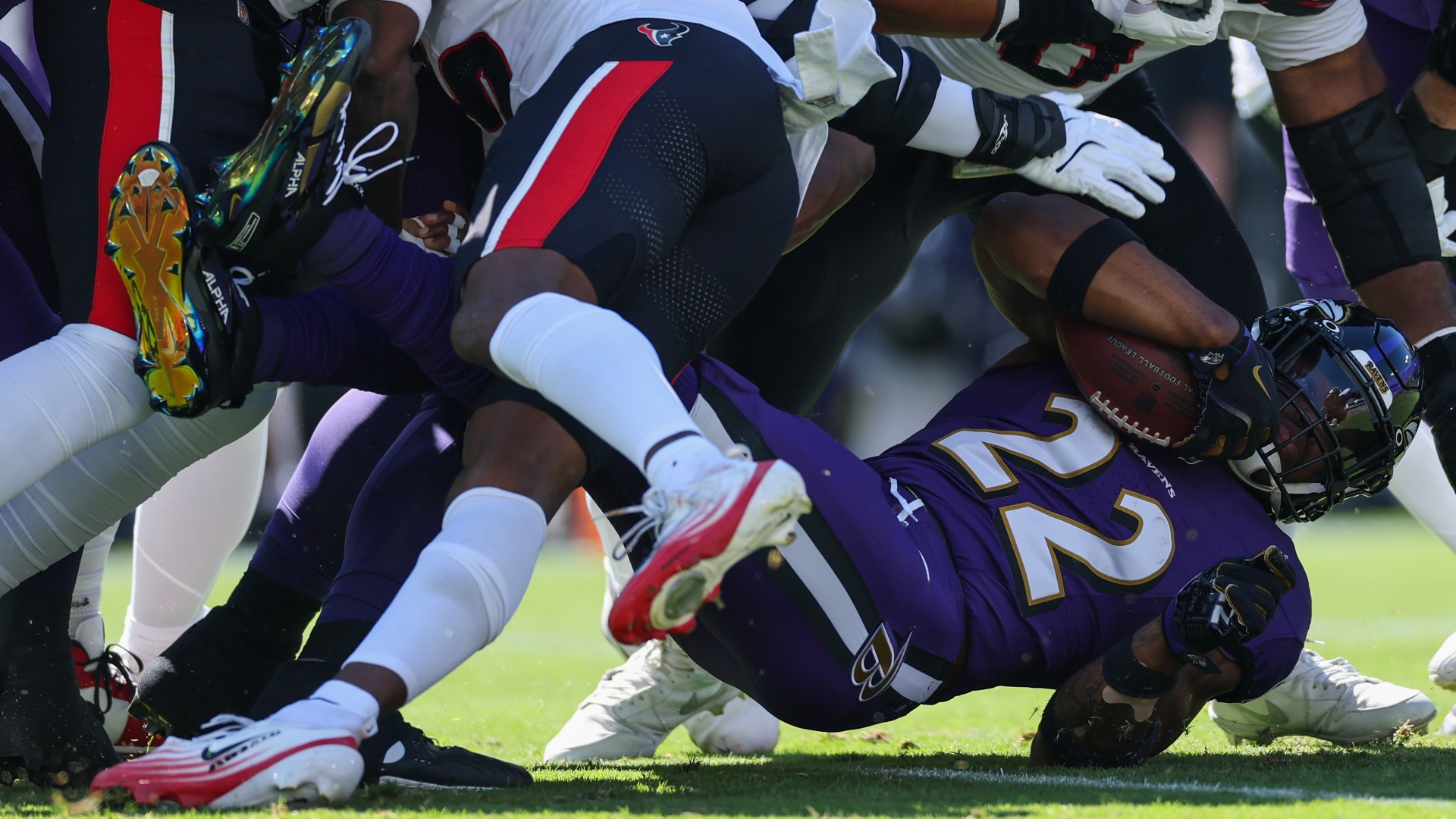 Baltimore Ravens running back Derrick Henry getting knocked on his back against the Houston Texans