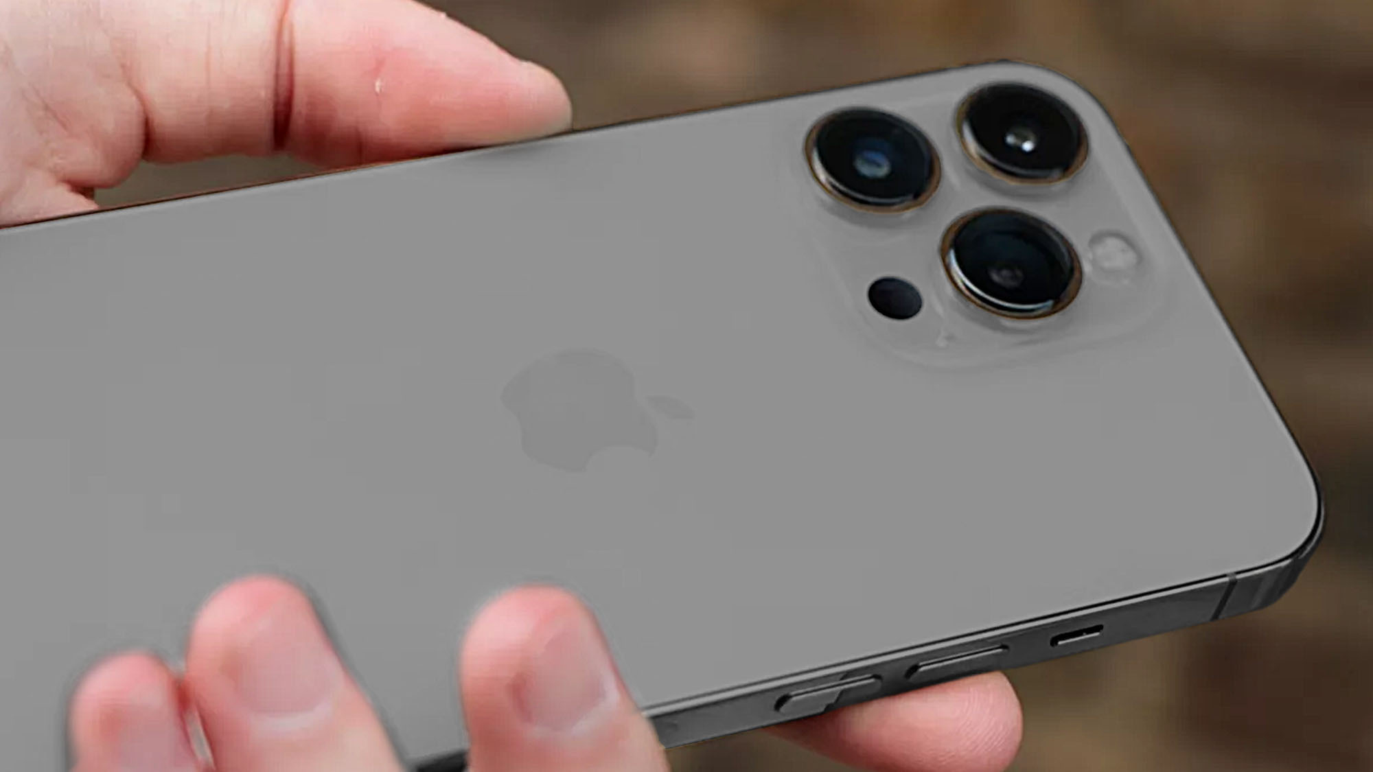An iPhone 13 Pro photo edited to show a graphite shade