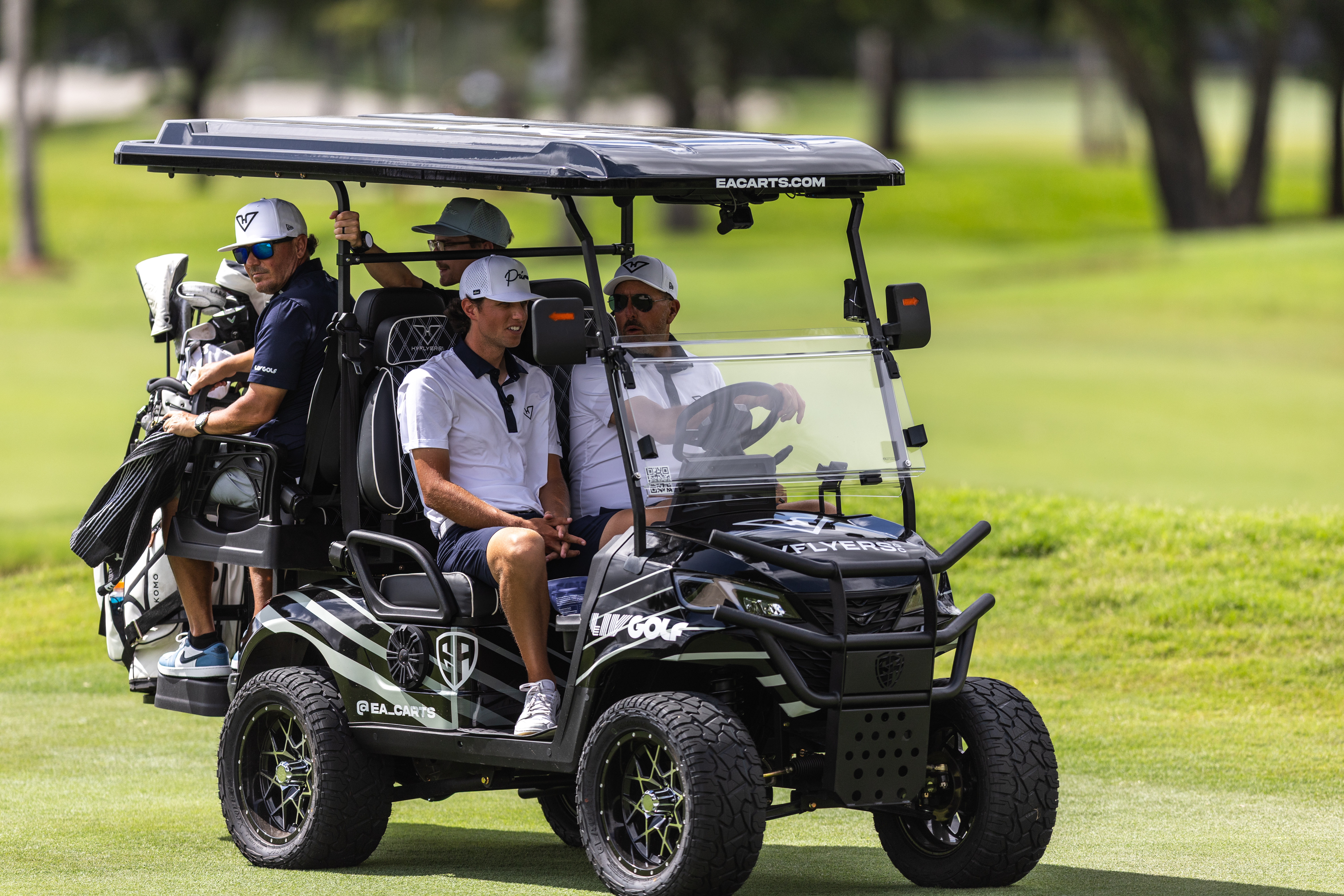 Grant Horvat and Phil Mickelson in a buggy