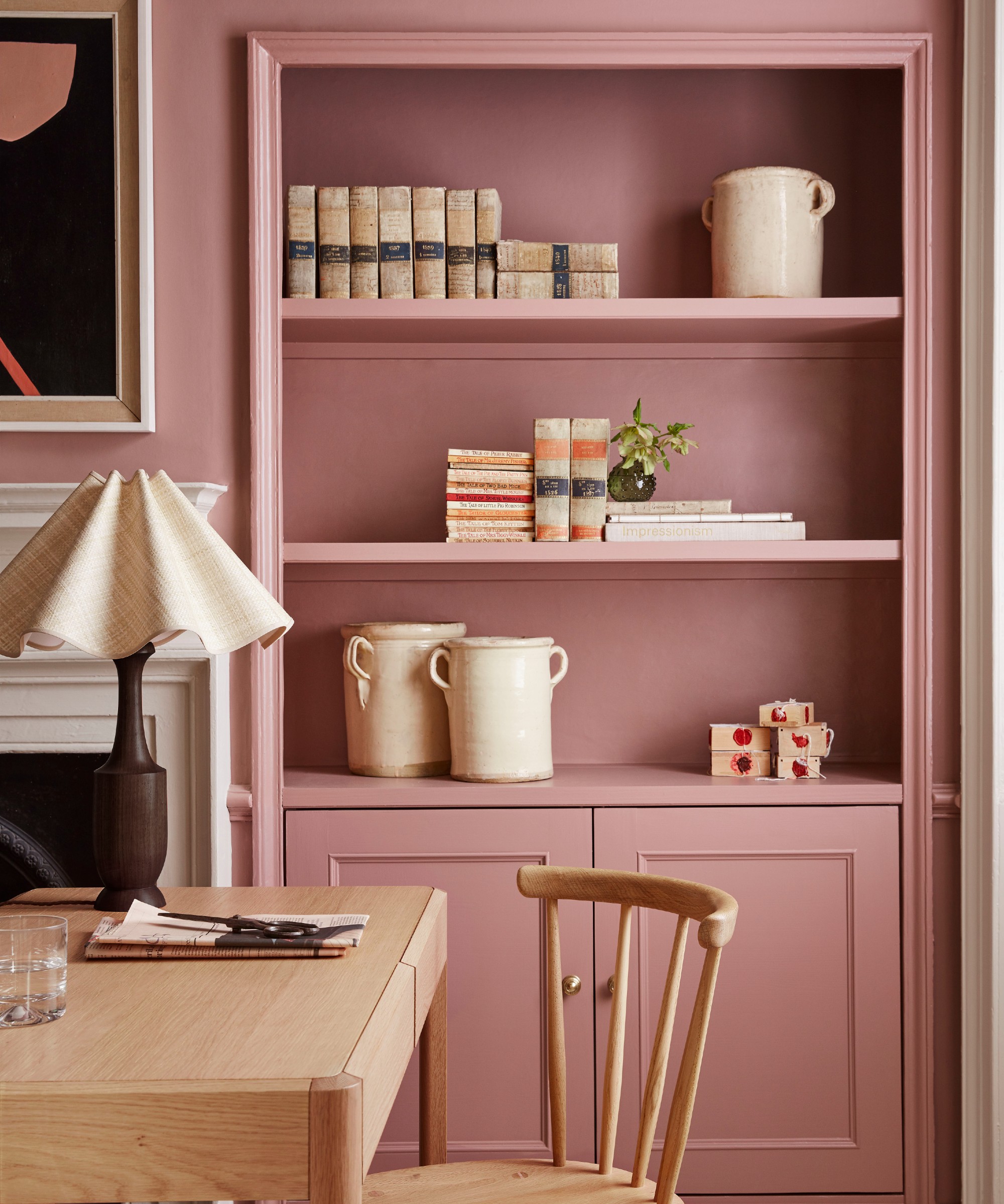 A home office nook colour-drenched in Little Greene's Blush pink paint shade with a built-in bookcase