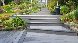 sloping garden ideas: decked steps connecting different levels of a sloping garden