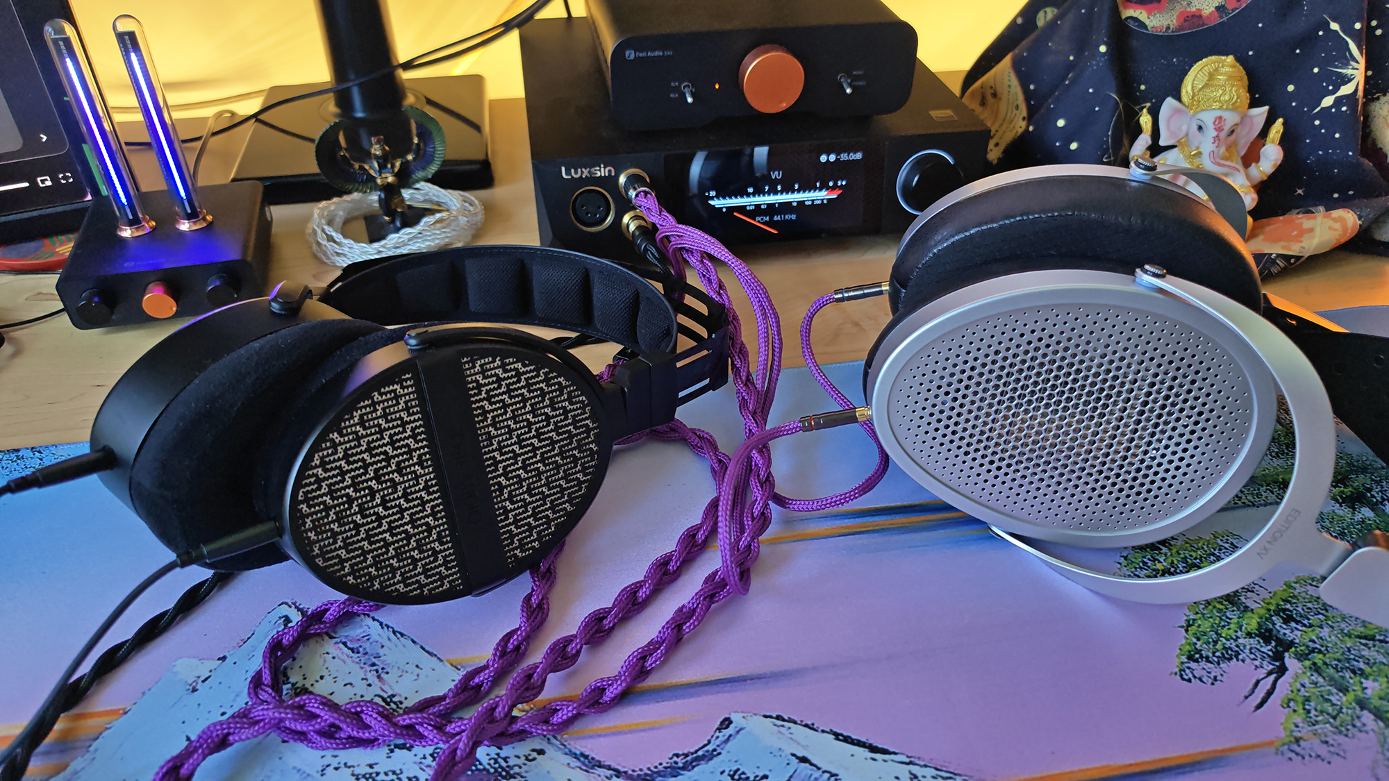 Two headphones on a desktop.