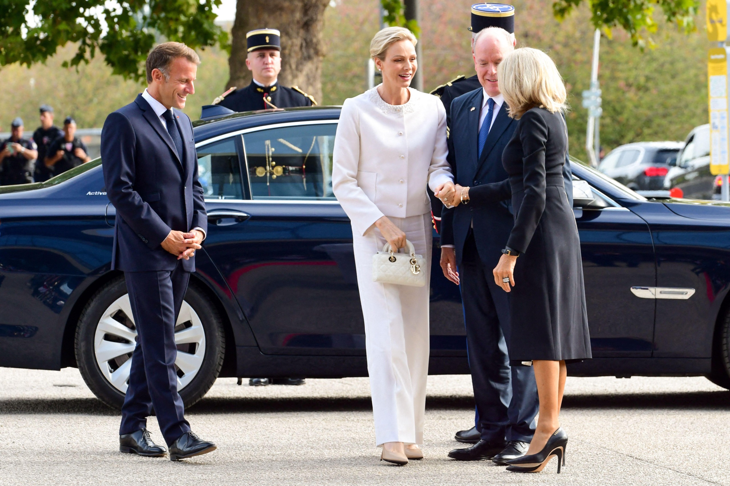 Princess Charlene shakes hands with Brigitte Macron