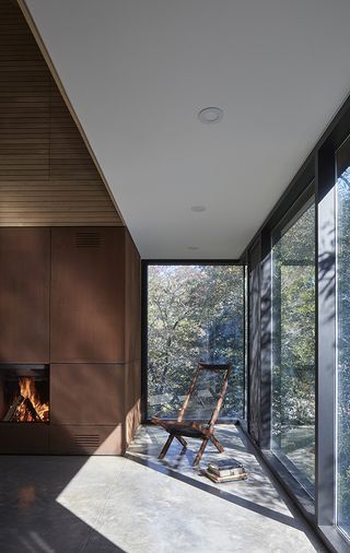 seating and fireplace in minimalist chester house, a canadian country home