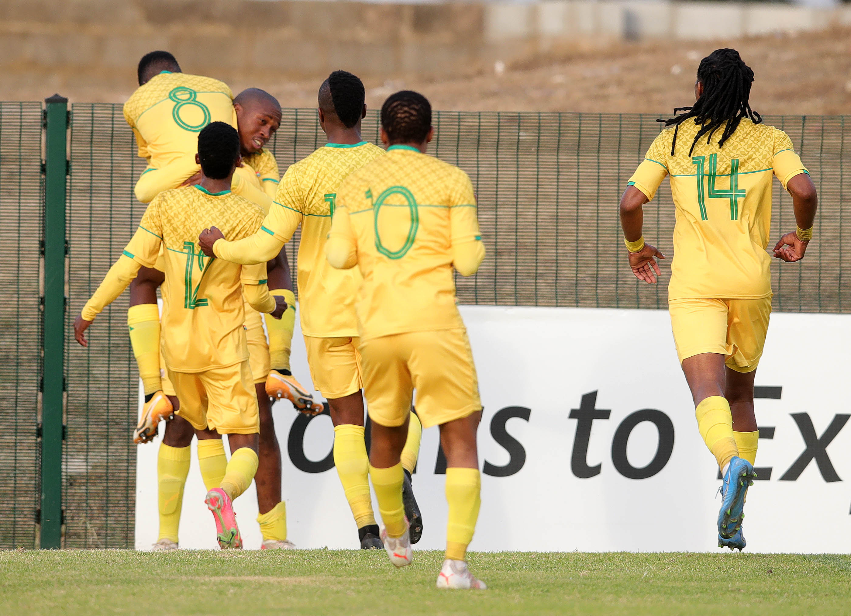 Thabang Sibanyoni of South Africa celebrates goal with teammates