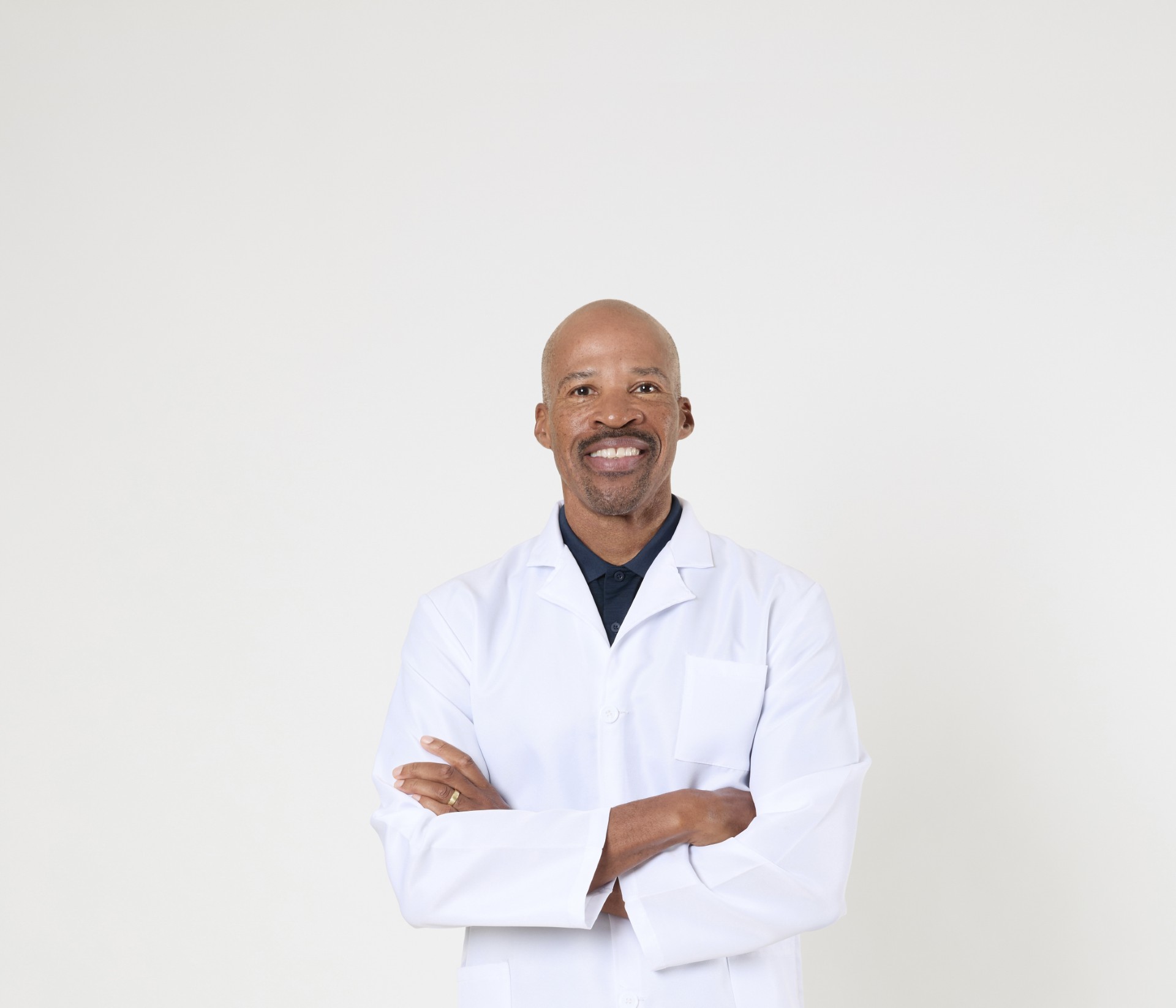 a black man in a white lab coat