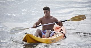 Mason Morgan appears on a kayak in the bay in Home and Away.