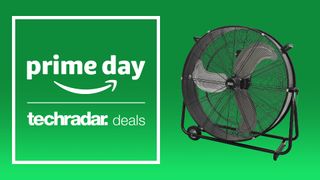 A black floor fan with wheels next to a sign saying Prime Day fan deals.